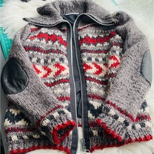 Oversized front zipper sweater with black, white, red and grey pattern.